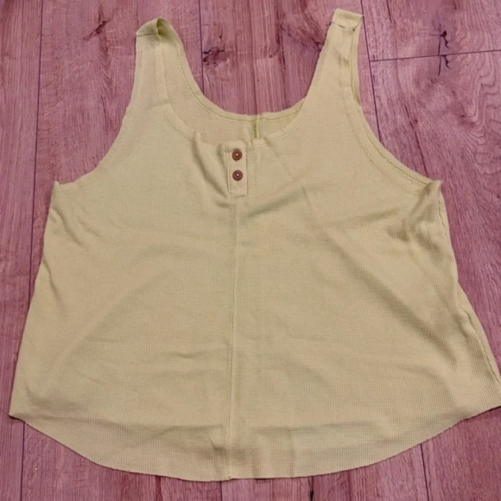 Nike Dri-FIT waffle tank top in a soft light green shade.